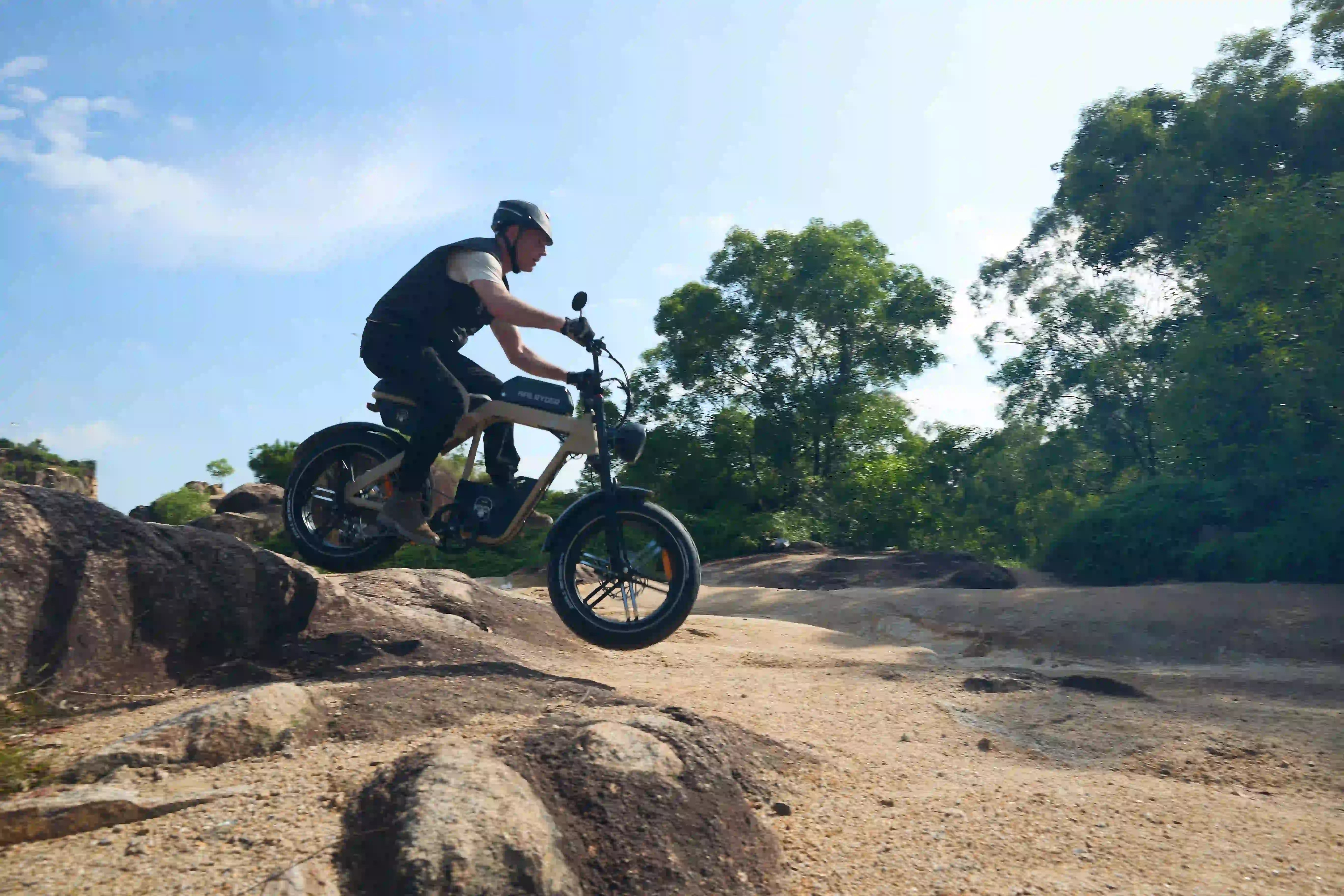 man riding e-mountain bike