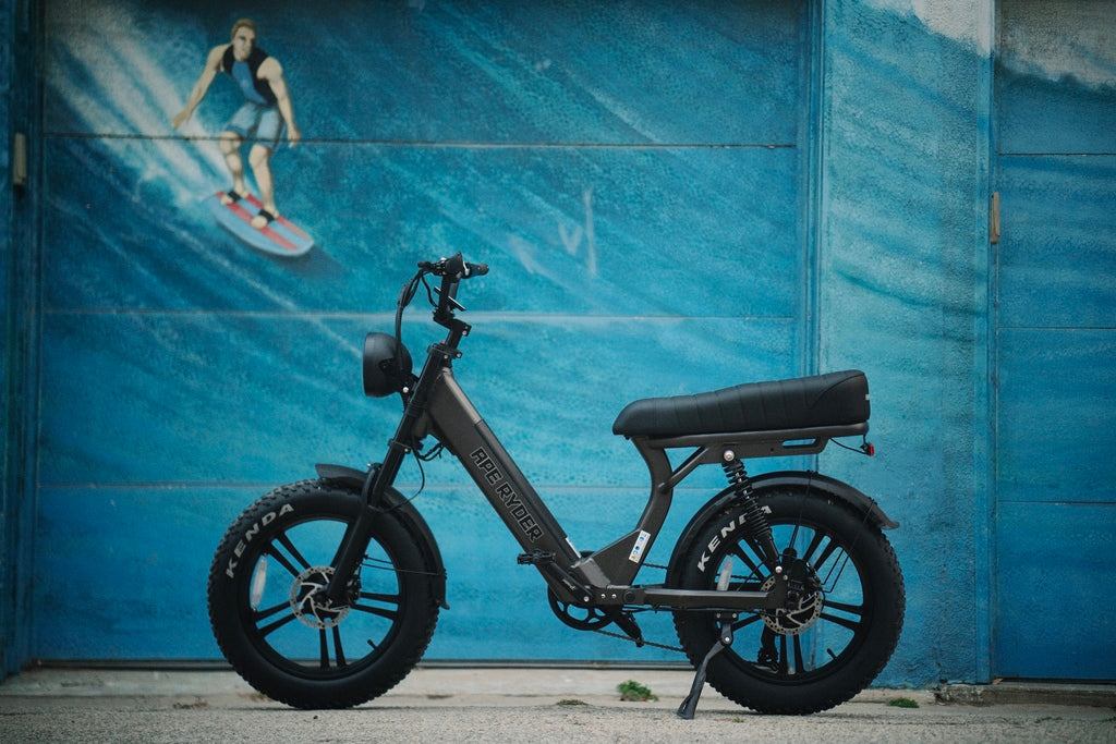 Black ebike in front of a wall