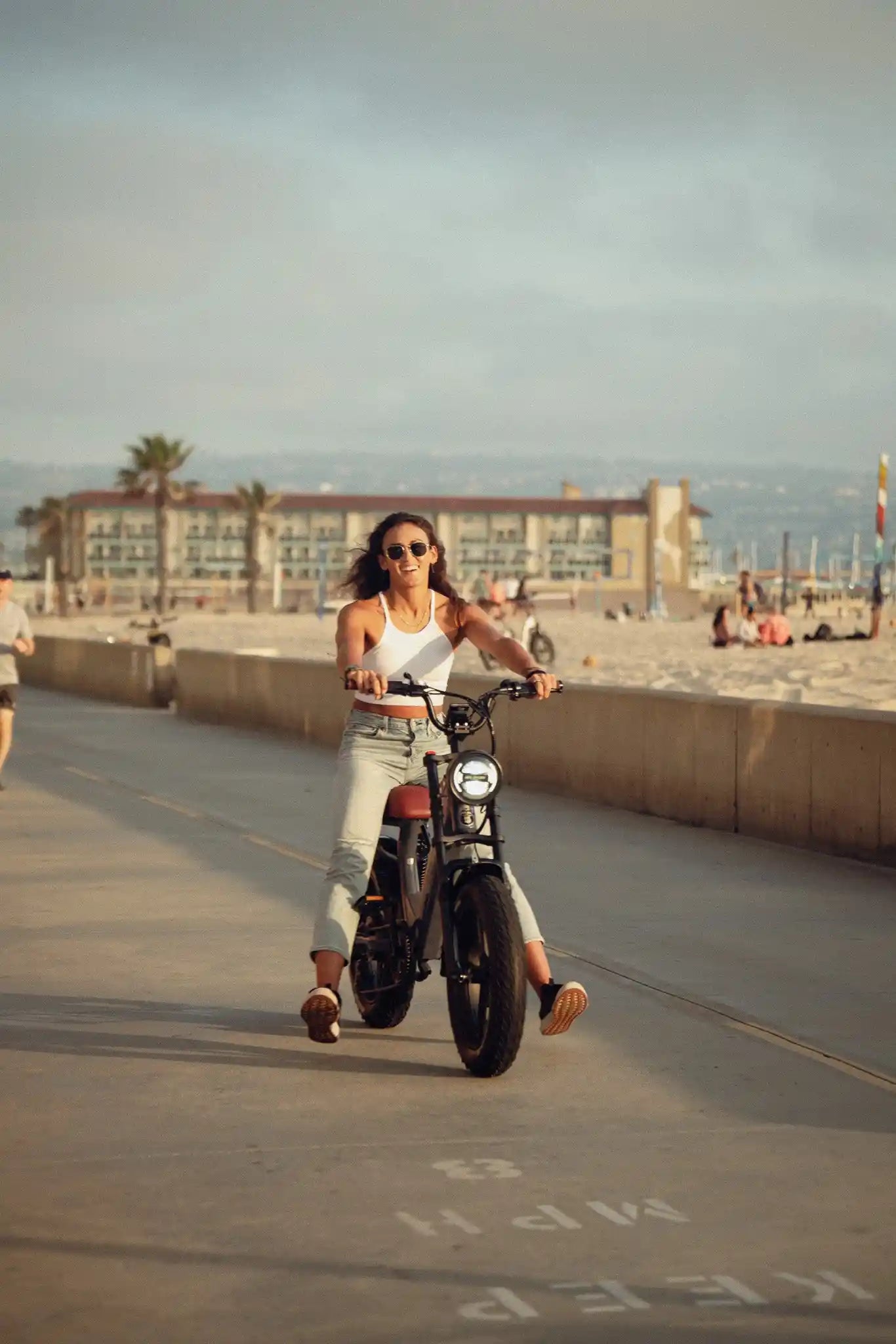 tall woman riding her e-bike