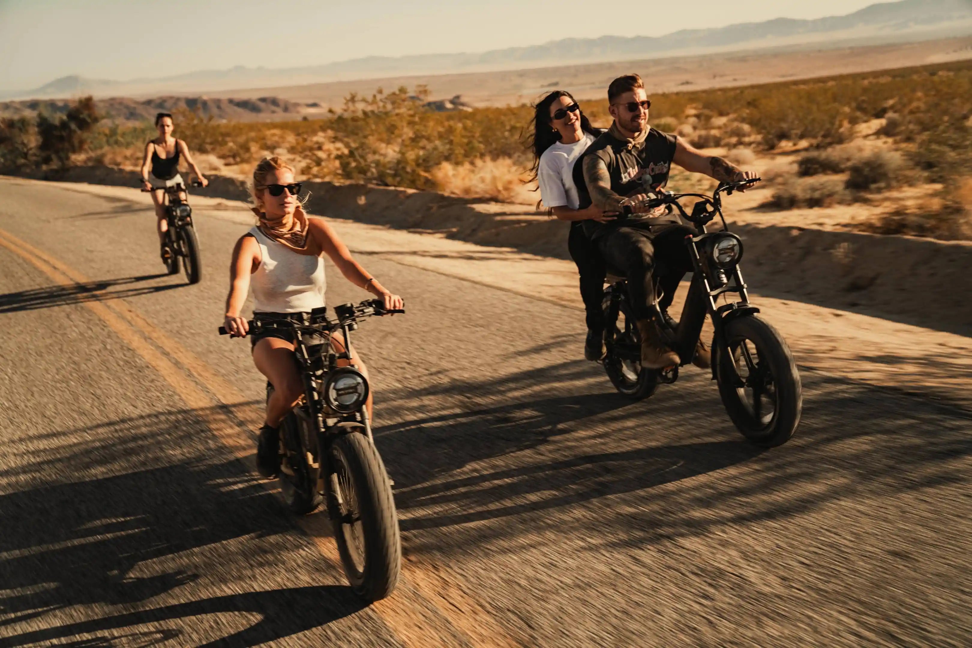 three friends riding their e-bikes